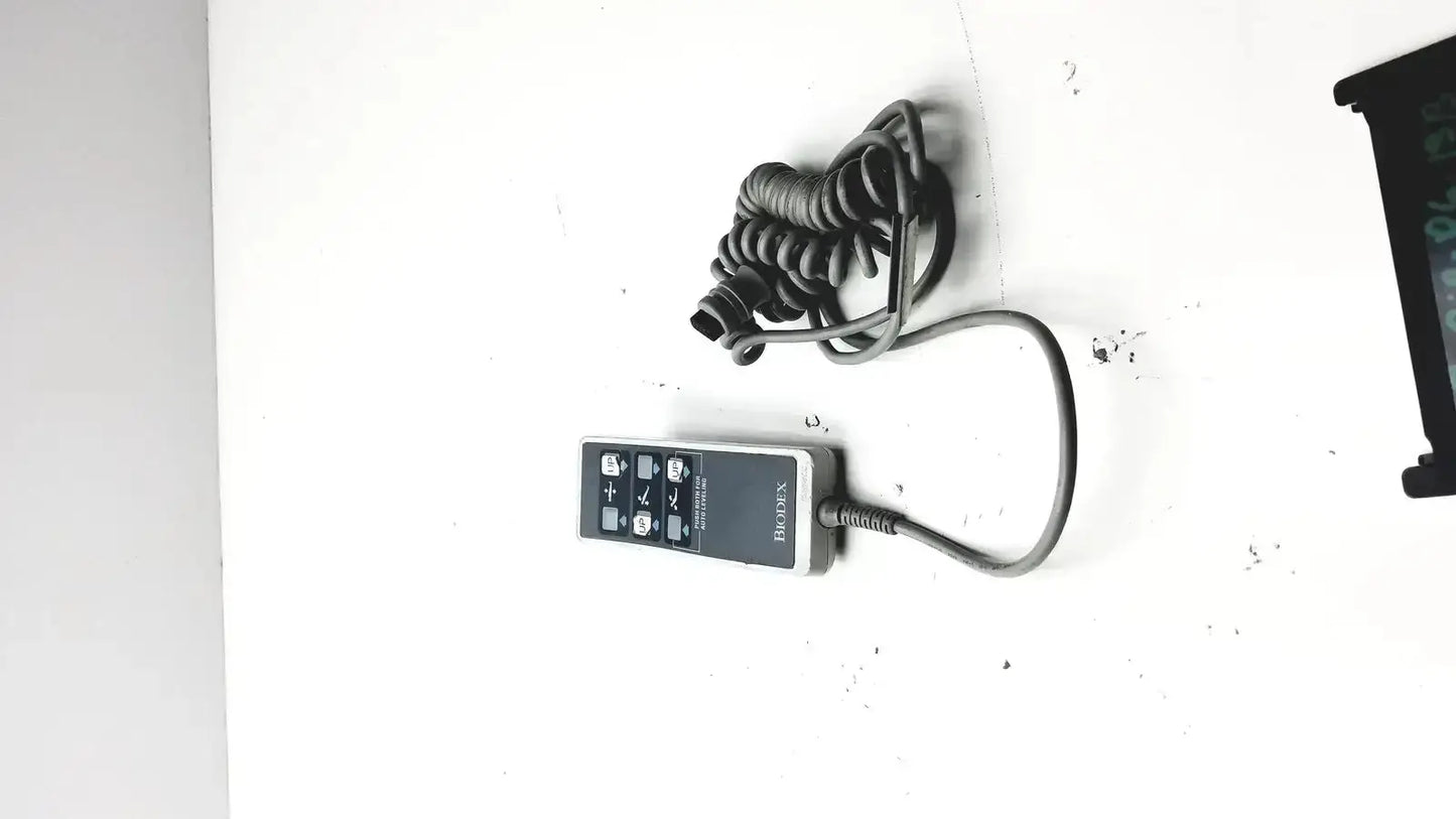 Black and gray bosch remote controller with coiled cord for biodex ultrasound table ultrasound table remote