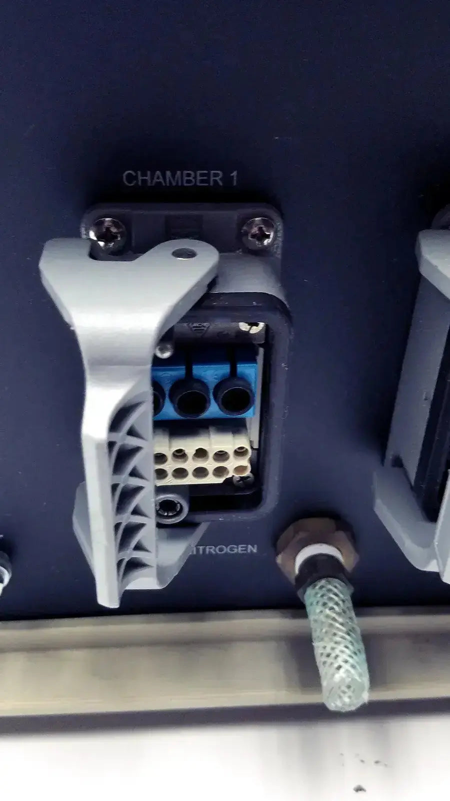 Gray plastic connector housing with blue and beige terminal blocks labeled chamber 1 on biospherix oxycycler a84xov dynamic controller