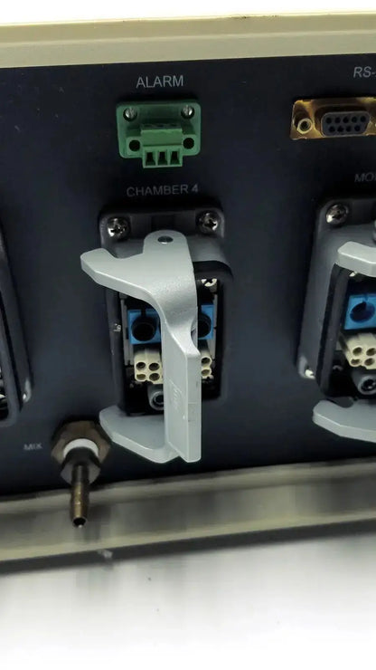 Gray plastic latch securing a blue and white terminal block on the back of biospherix oxycycler a84xov dynamic controller