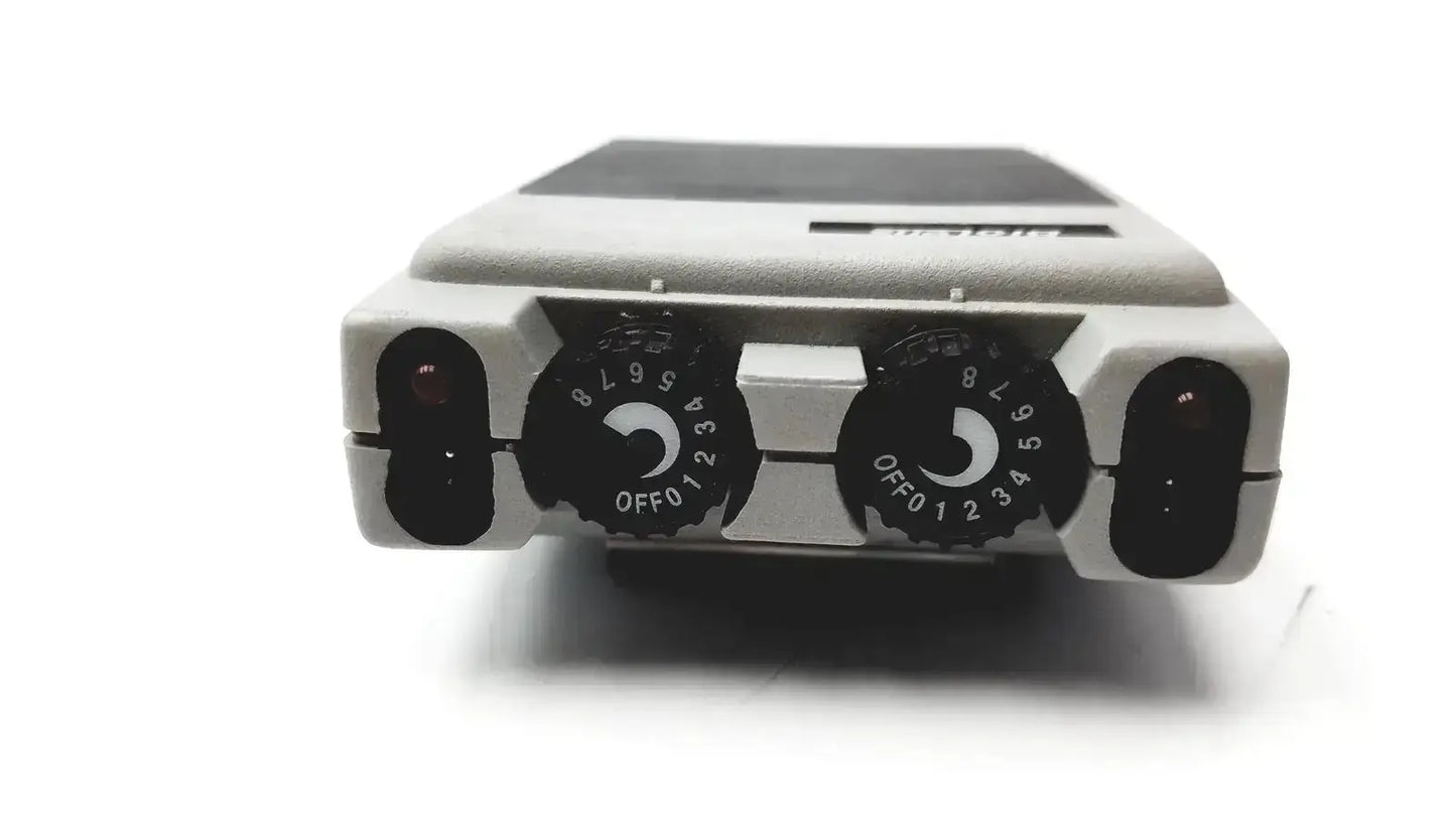 Gray plastic biotens transcutaneous electrical nerve stimulator with black rotary dials and dark gray top panel