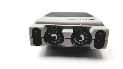 Gray plastic biotens transcutaneous electrical nerve stimulator with black rotary dials and dark gray top panel