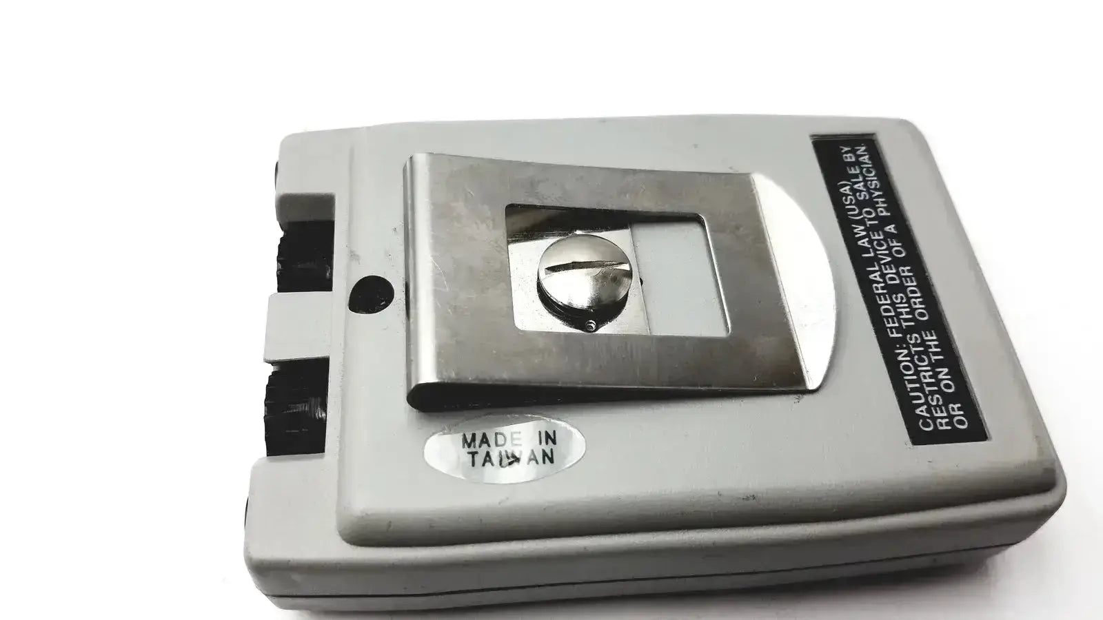 Gray plastic biotens transcutaneous electrical nerve stimulator with metallic silver cassette compartment and regulatory label