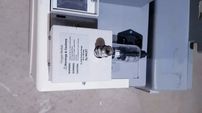 White oxygen module with clear glass cylinder and metal fittings for bipap vision ventilatory support system 582059 with stand