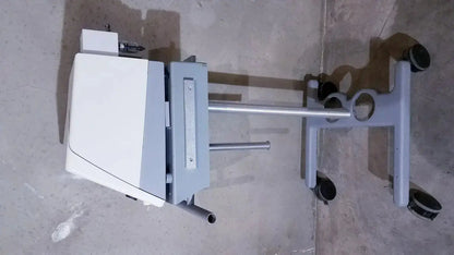 Gray medical cart with bipap vision ventilatory support system mounted on white and gray stand with four black caster wheels