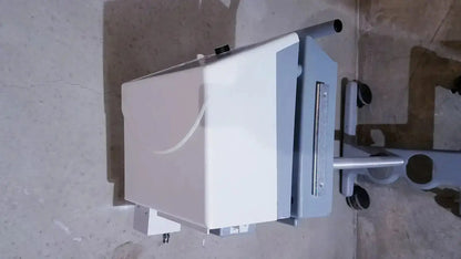 White and gray bipap vision ventilatory support system 582059 with stand featuring a sleek modern medical imaging design