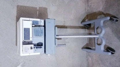 Gray bipap vision ventilatory support system cart with white control unit and silver handlebar with stand