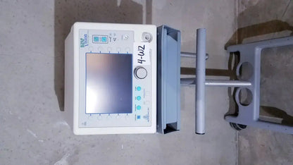 White rectangular bipap vision ventilatory support system monitor with screen and control buttons on front panel with stand