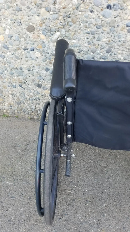 Black Invacare Tracer SX5 Wheelchair Featuring Sturdy Arm Rests