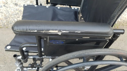 Black Invacare Tracer SX5 Wheelchair Featuring Sturdy Arm Rests