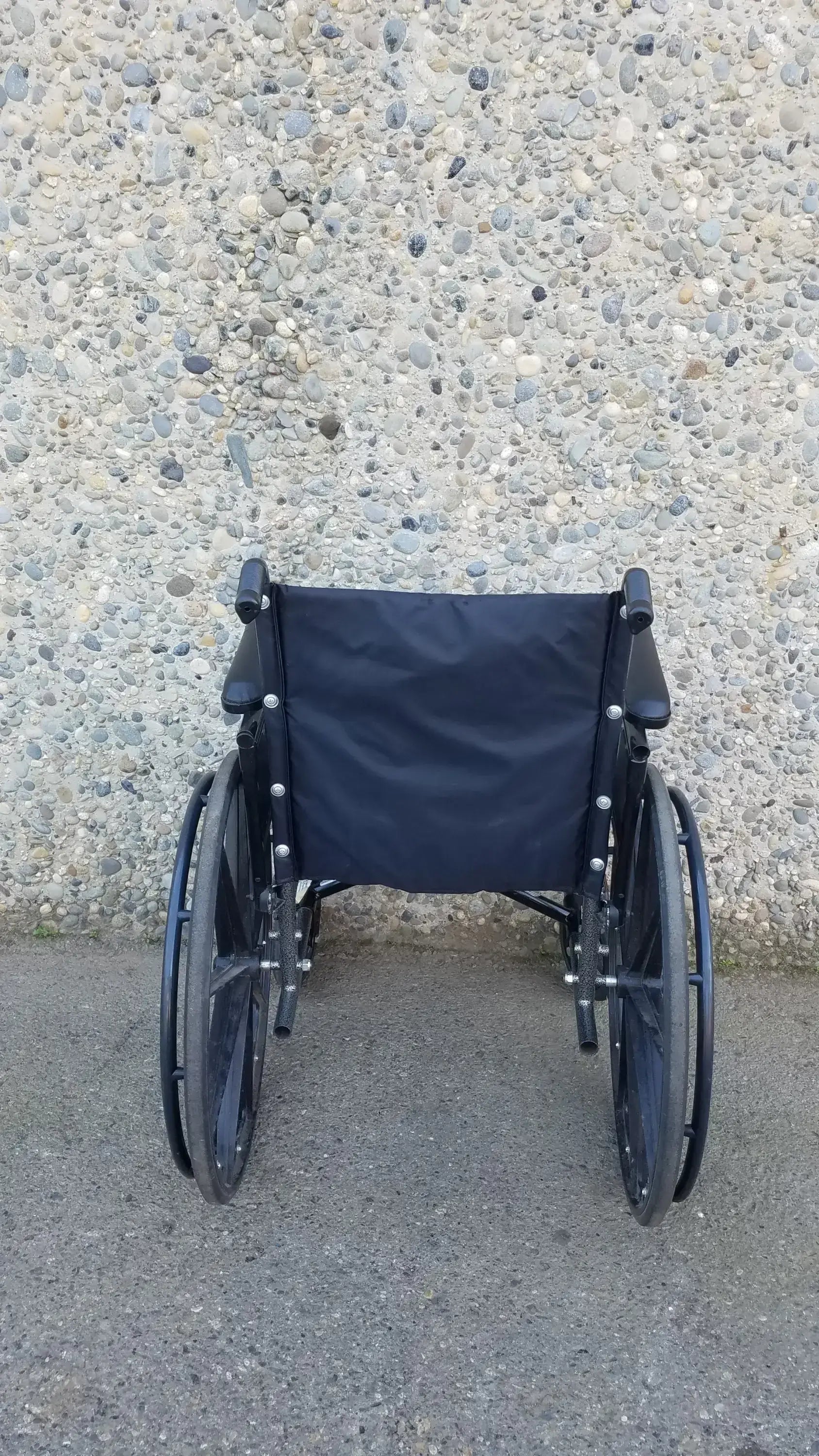 Black Invacare Tracer SX5 Wheelchair Featuring Sturdy Arm Rests