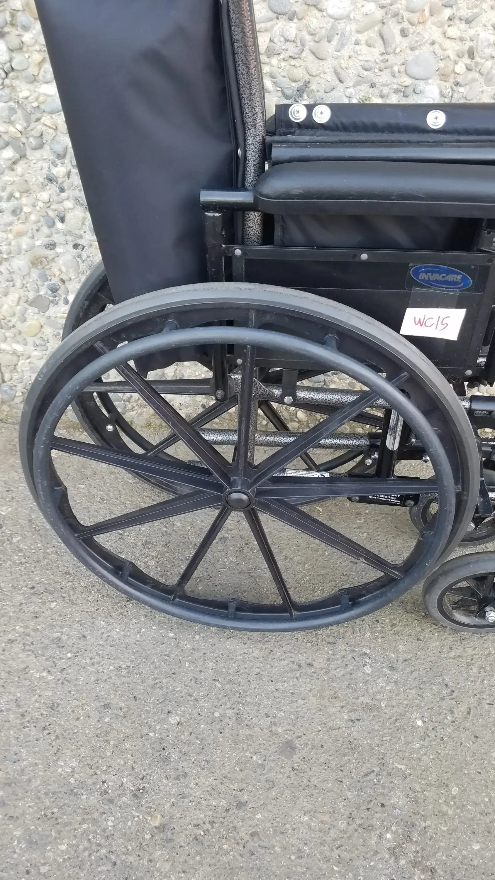 Black Invacare Tracer SX5 Wheelchair Featuring Sturdy Arm Rests