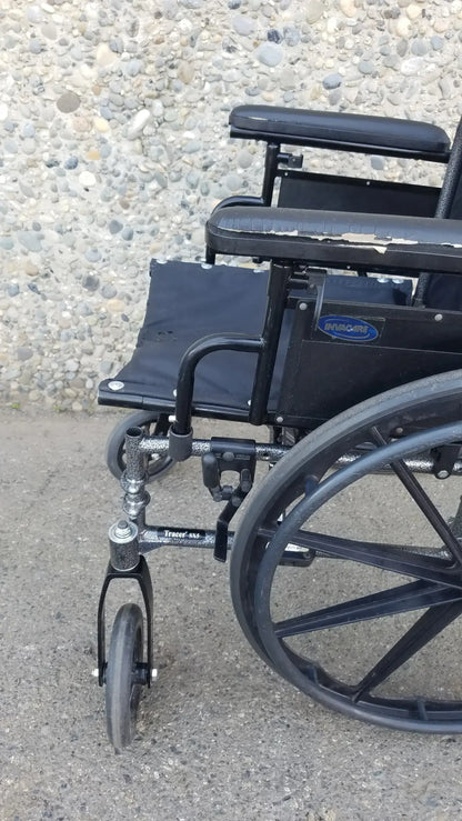 Black Invacare Tracer SX5 Wheelchair Featuring Sturdy Arm Rests