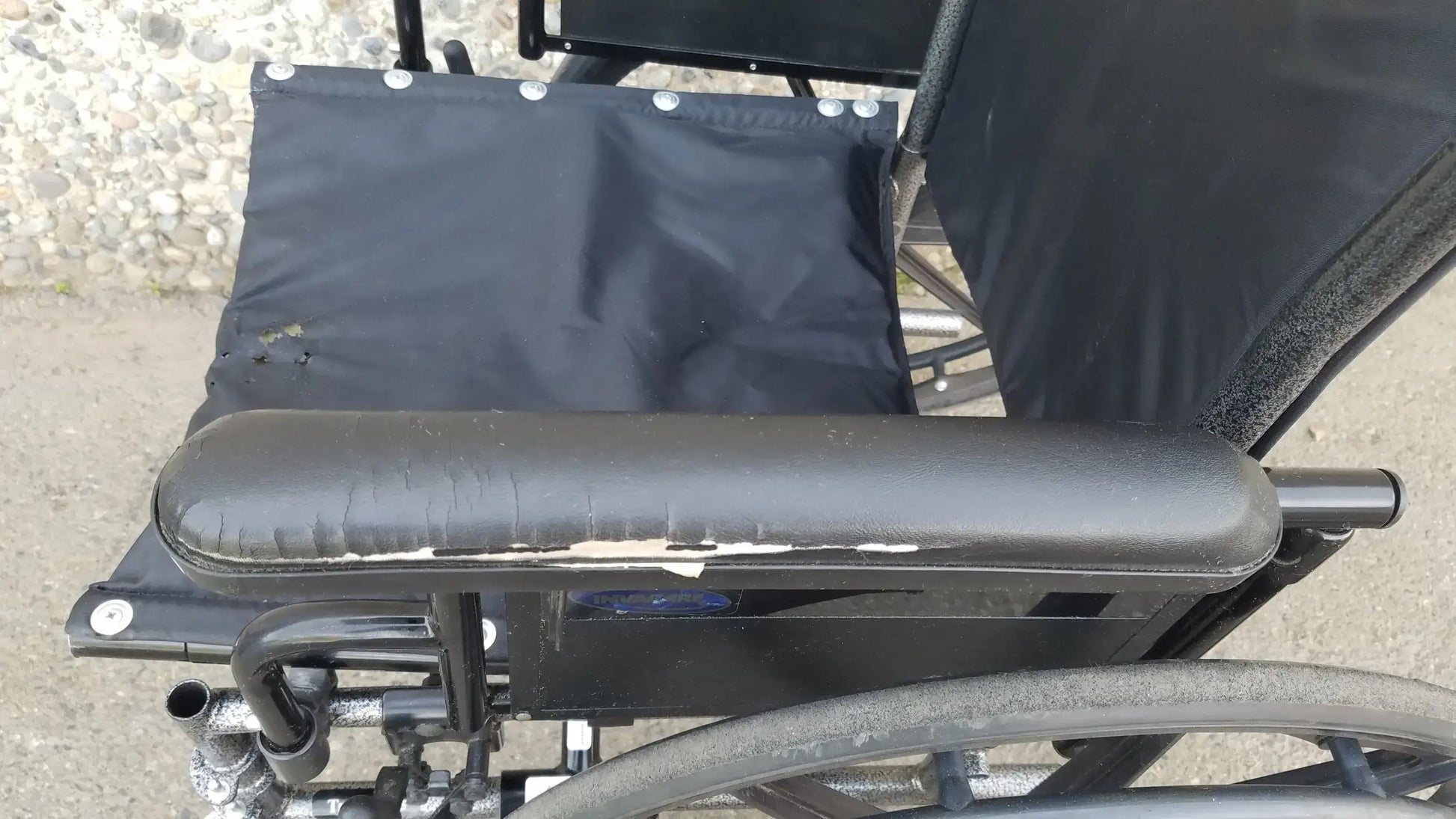 Black Invacare Tracer SX5 Wheelchair Featuring Sturdy Arm Rests