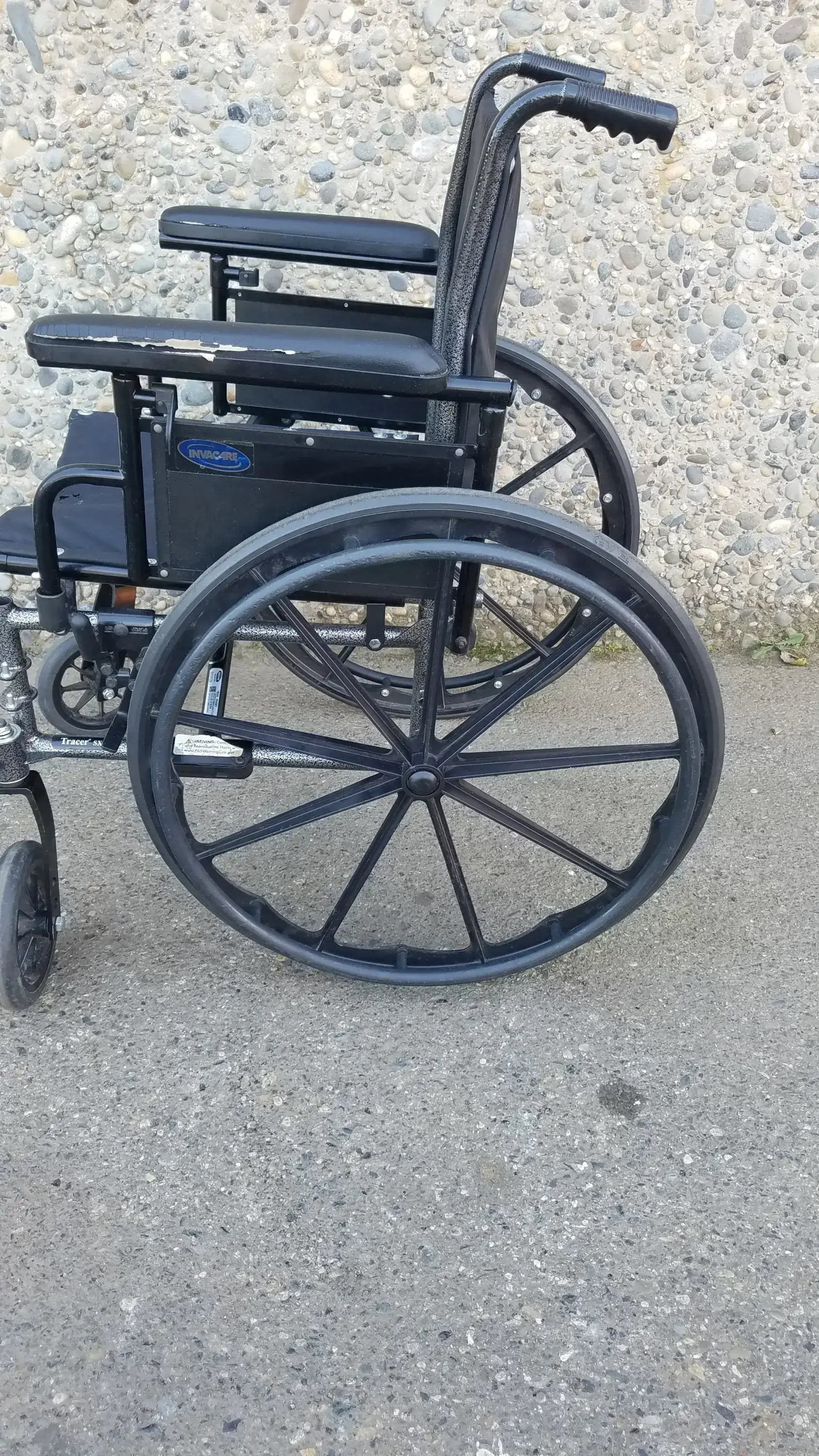 Black Invacare Tracer SX5 Wheelchair Featuring Sturdy Arm Rests