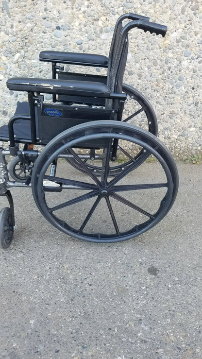 Black Invacare Tracer SX5 Wheelchair Featuring Sturdy Arm Rests