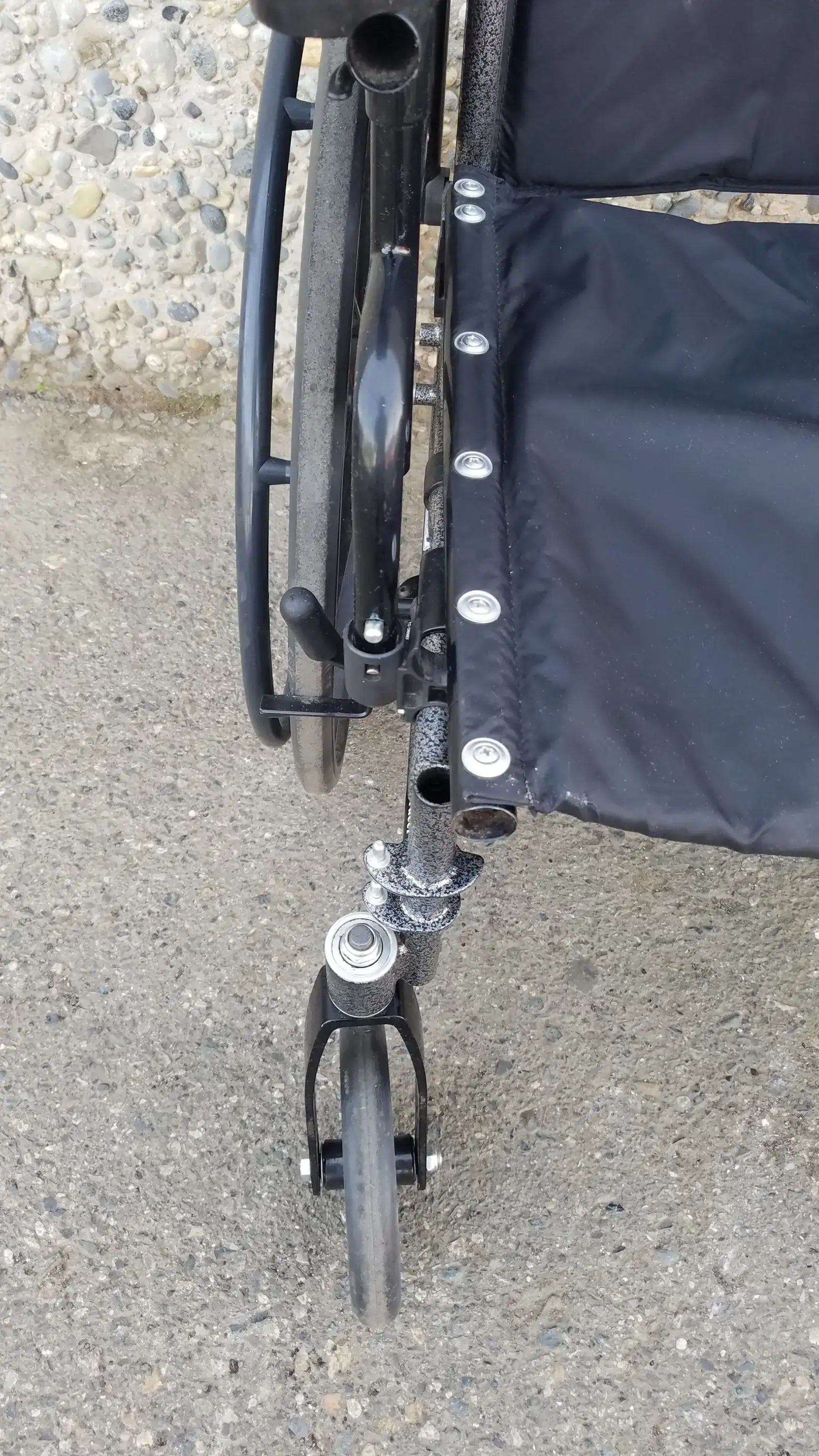 Black Invacare Tracer SX5 Wheelchair Featuring Sturdy Arm Rests