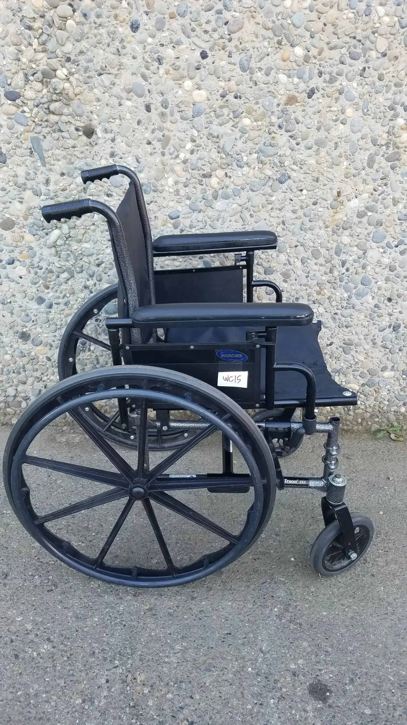 Black Invacare Tracer SX5 Wheelchair Featuring Sturdy Arm Rests