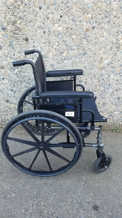 Black Invacare Tracer SX5 Wheelchair Featuring Sturdy Arm Rests