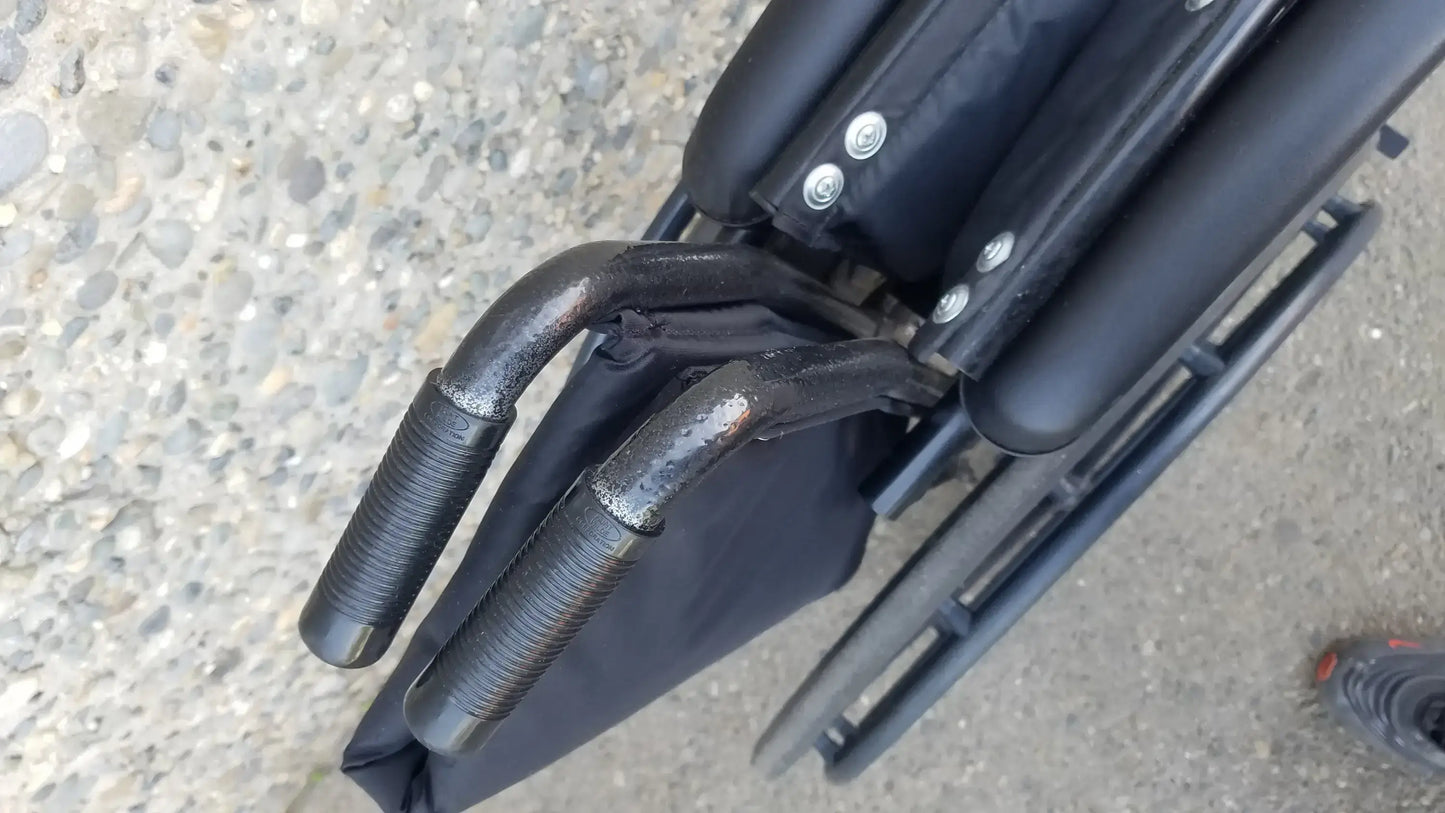 Black Invacare Tracer SX5 Wheelchair Featuring Sturdy Arm Rests