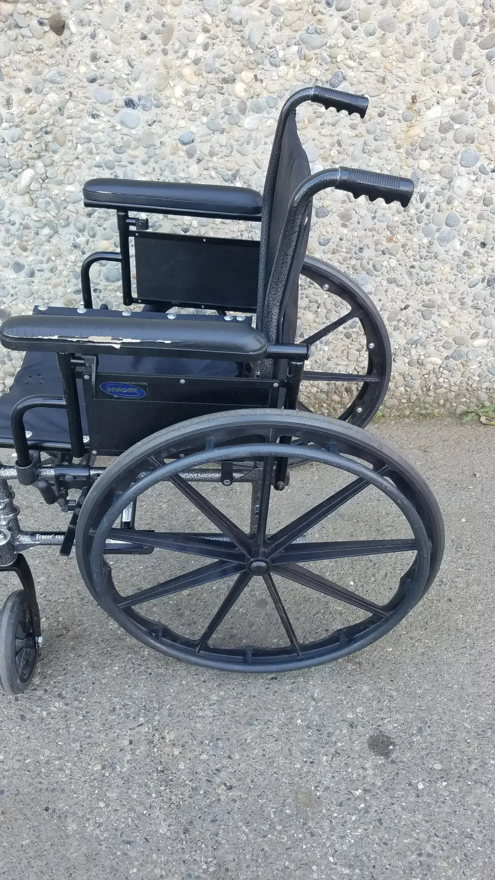 Black Invacare Tracer SX5 Wheelchair Featuring Sturdy Arm Rests