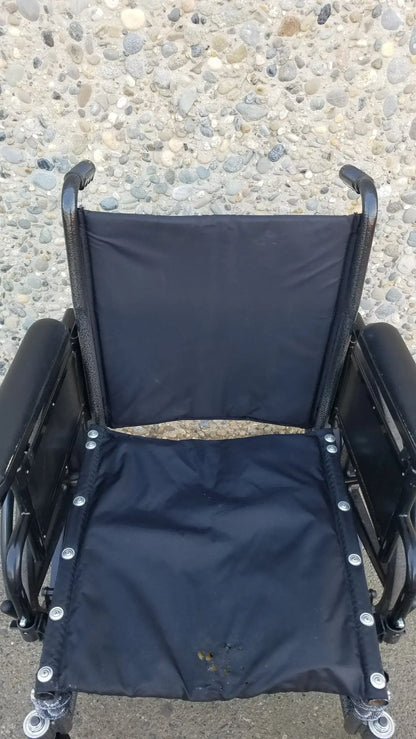Black Invacare Tracer SX5 Wheelchair Featuring Sturdy Arm Rests