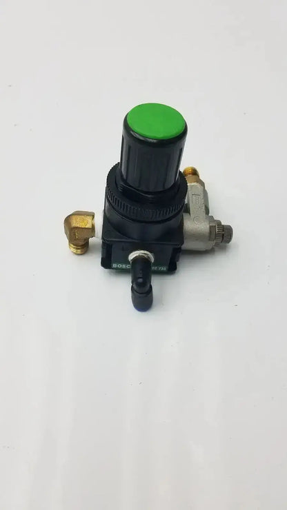Black and silver bosch pressure reducer throttle valve with a bright green top knob for precise air pressure control