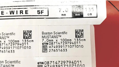 Boston scientific mustang otw medical wire 7.0mm x 100mm with label and barcode on white against red background