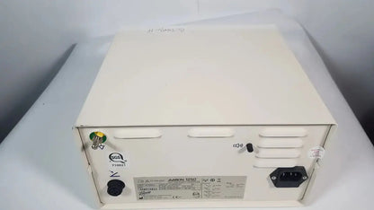 Cream-colored metal power supply unit with black ac input plug and ventilation slots for bovie aaron 1250 electrosurgical generator hospital surplus