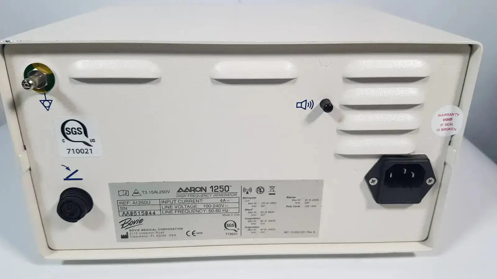 White plastic bovie aaron 1250 electrosurgical generator back with black power input and ventilation slits from hospital surplus