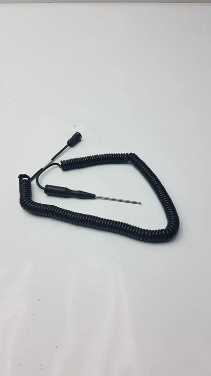 Black coiled cable thermometer probe with thin metallic tip and two connectors for hospital surplus biomedical technicians