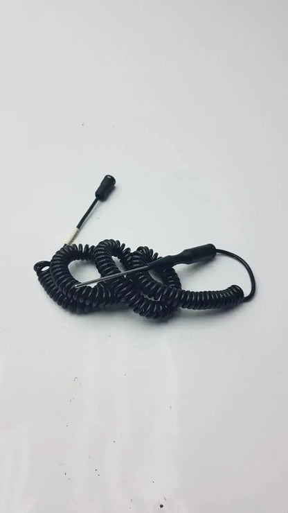 Black coiled thermometer probe cable with metal pin and plastic connectors for hospital surplus biomedical technicians