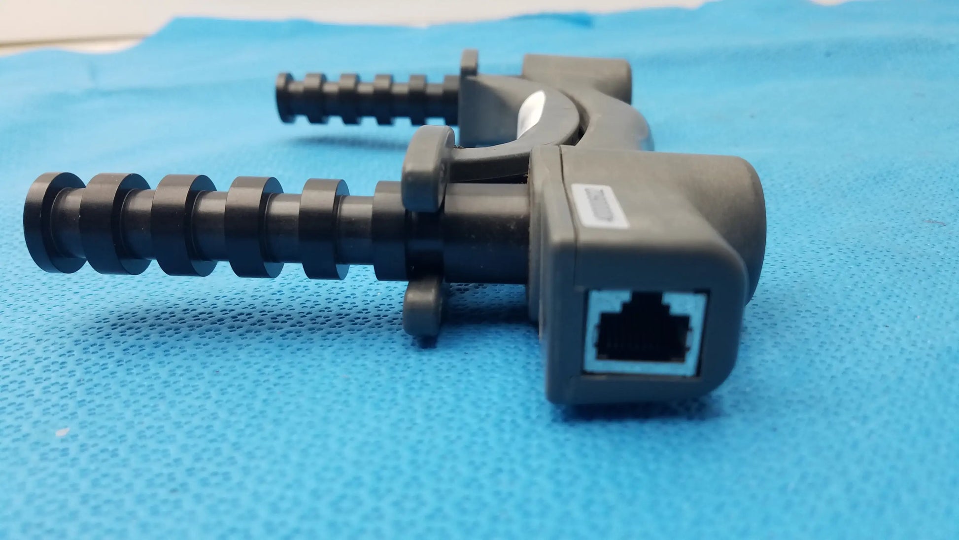 Black plastic ethernet cable clamp with threaded adjustment and rj45 port for bte technology hydraulic hand dynamometer