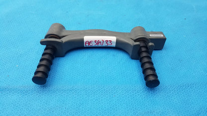 Dark gray plastic car air conditioning condenser bracket with ribbed black cylindrical ends for hydraulic hand dynamometer use