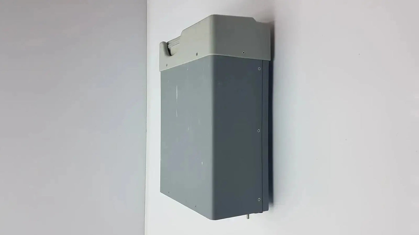 Gray rectangular wall-mounted battery unit with lighter top section and mounting hardware for buffalo filter virovac smoke evacuation