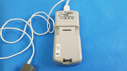 Beige plastic Burdick OXY 100 pulse oximeter ref 92521 with white power cord for reuse medical equipment applications