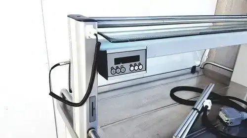 Silver metallic industrial workbench with digital control panel and black coiled cables burlodge multigen ii blm52 returned items