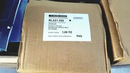 Brown cardboard box labeled with burlodge multigen ii blm52 schnecken trolley walt containing returned items