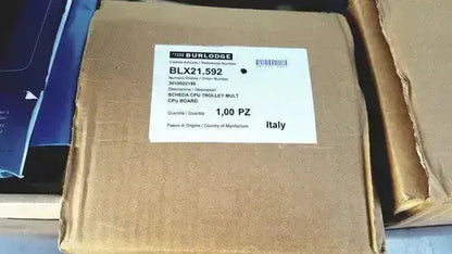 Brown cardboard box labeled with burlodge multigen ii blm52 schnecken trolley walt containing returned items