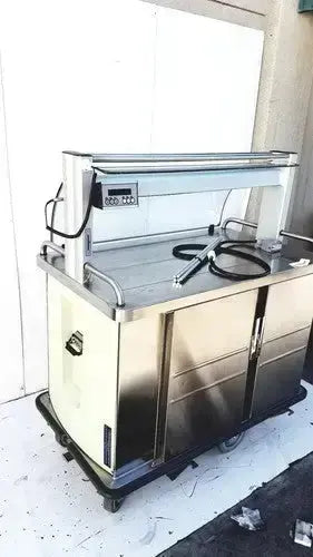 Stainless steel burlodge multigen ii blm52 food cart with digital display and black hoses on top for returned items