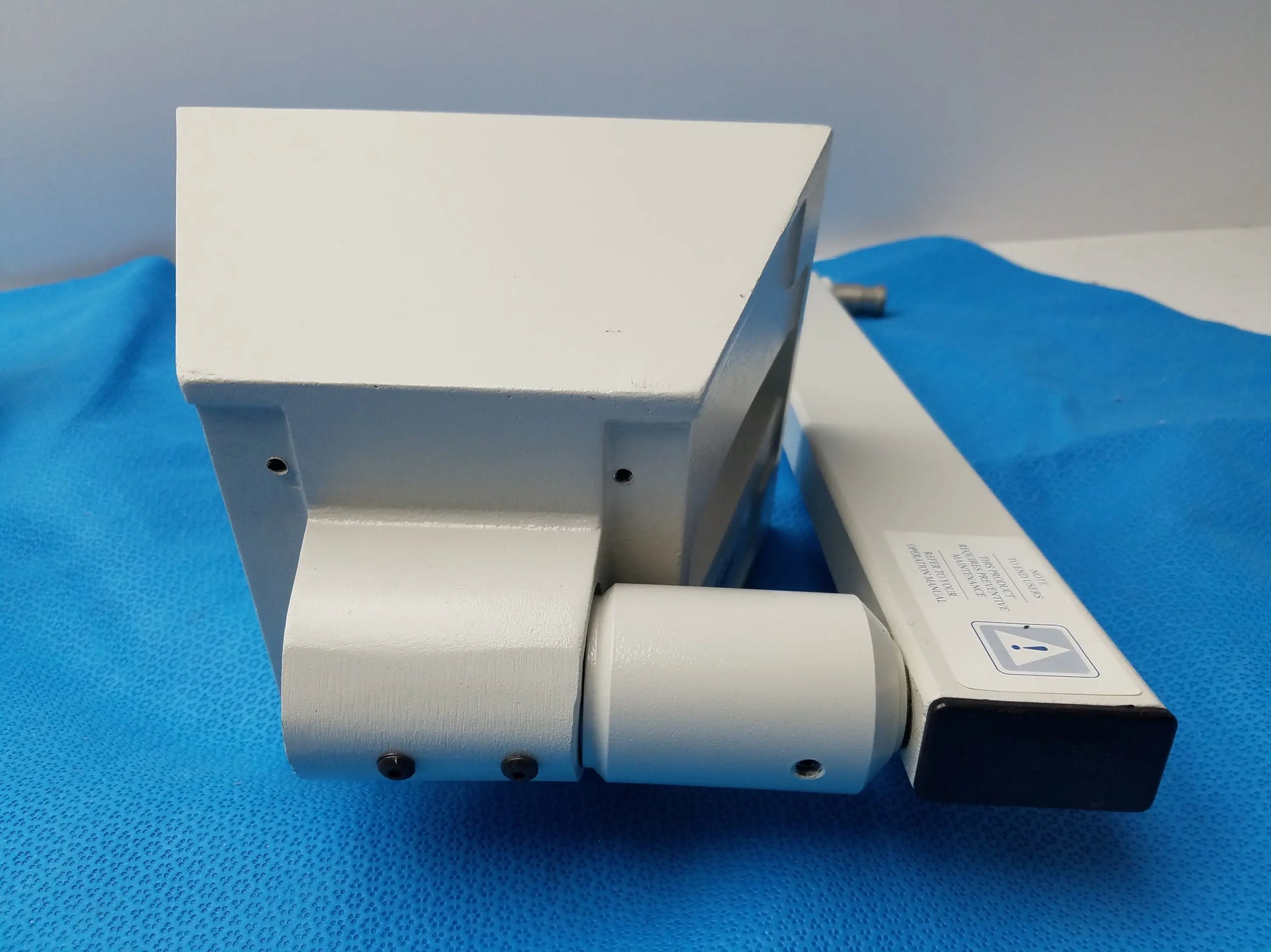 White plastic door closer with rectangular housing and cylindrical roller for burton medical outpatient ii examination light wall mount assembly medical equipment reuse medical equipment smiths medical