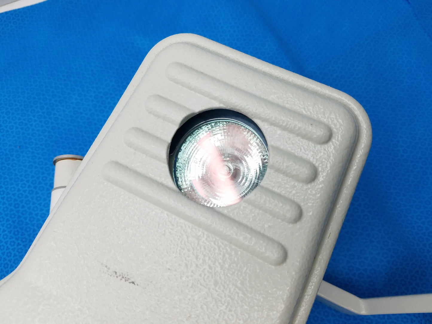 Gray textured outdoor floodlight with circular clear lens and ridged housing for burton medical outpatient ii examination light by smiths medical