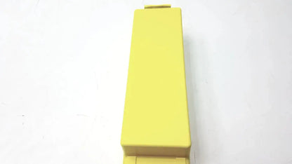 A solid yellow rectangular plastic cardiac science intellisense lithium battery for powerheart g3 aed with rounded edges
