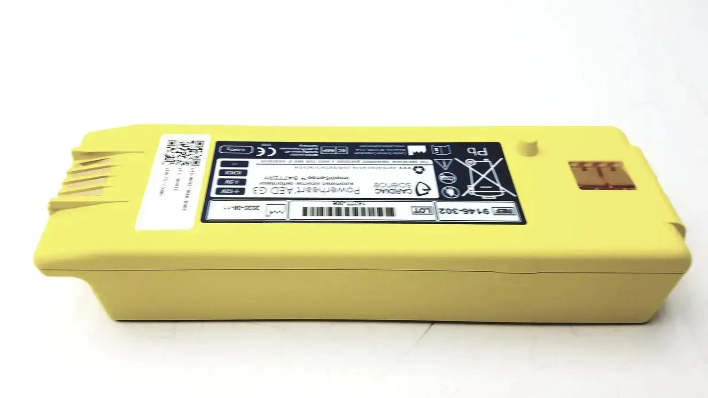 Yellow rectangular lithium battery with black label and barcode for cardiac science intellisense powerheart g3 aed by zoll