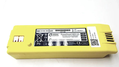 Yellow rectangular cardiac science intellisense lithium battery for powerheart g3 aed with black labeling and qr code