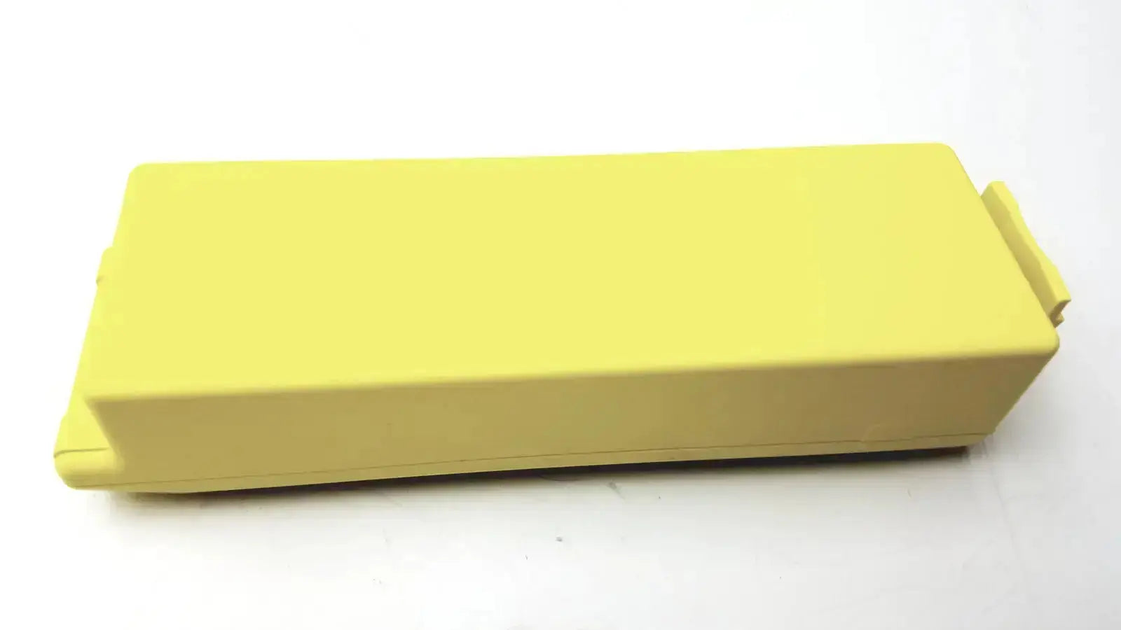 A solid yellow rectangular cardiac science intellisense lithium battery with a raised lid for powerheart g3 aed