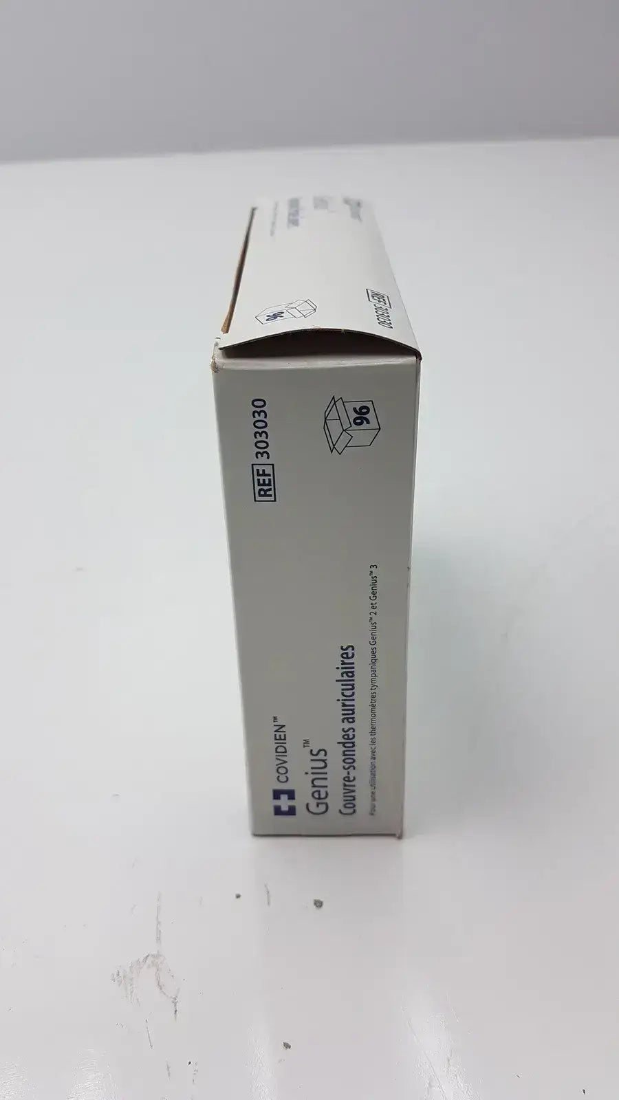 A gray cardboard box of cardinal health genius tympanic probe covers with 96 units and black text labeling
