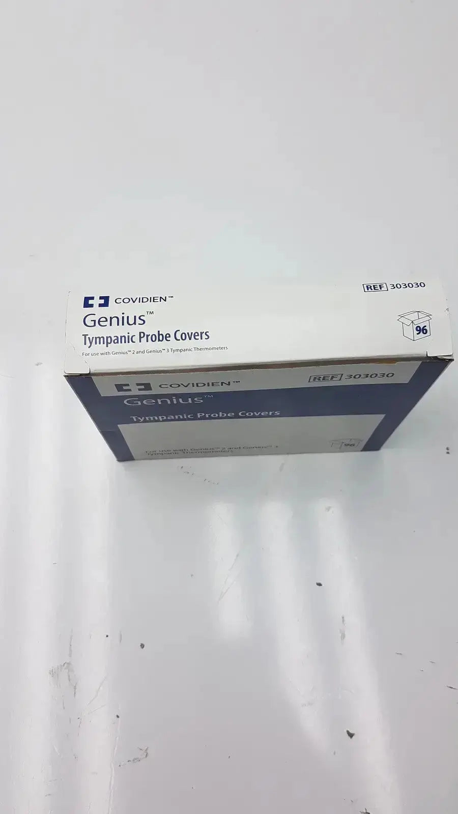 White and blue cardboard box of cardinal health genius tympanic probe covers for sanitary ear thermometer use