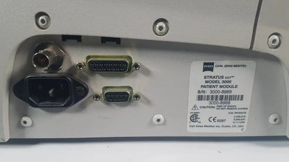 Silver-gray metallic back panel of carl zeiss stratus oct model 3000 patient module with multiple ports and label