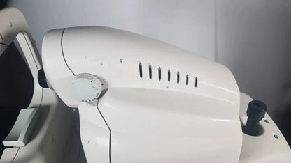 White plastic zeiss stratus oct patient module with circular dial and vertical slits for direct cross-sectional imaging