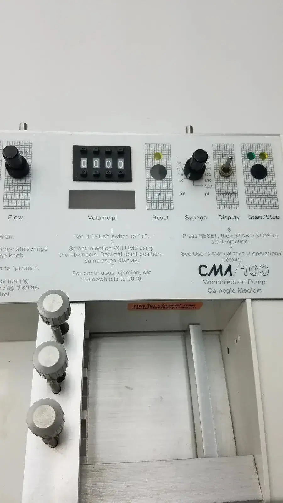 White Carnegie Medicin AB model CMA 100 microinjection pump with black digital display and gray control knobs